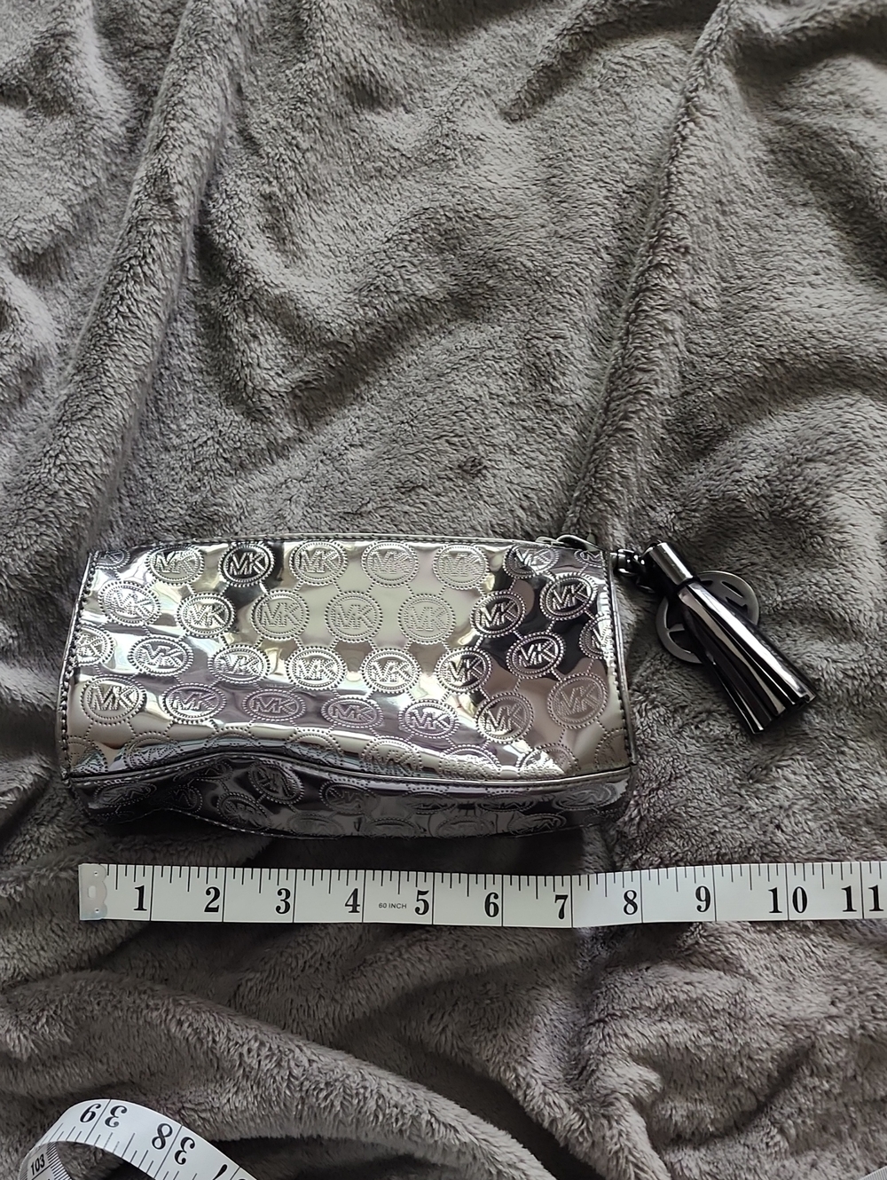 Michael Kors Metallic Silver MK Embossed Tassel Cosmetic Case